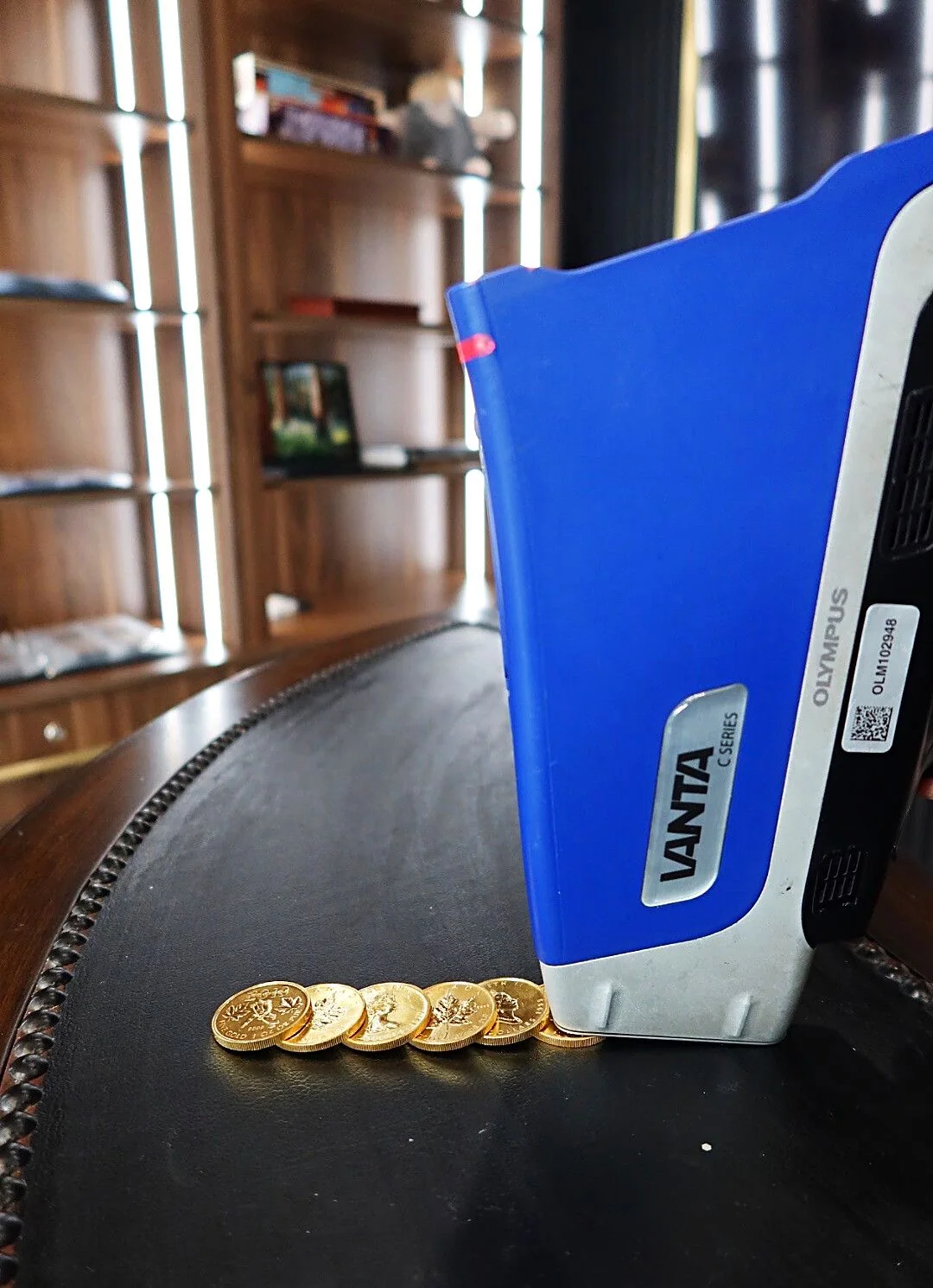 Olympus Vanta XRF analyzer testing gold coins