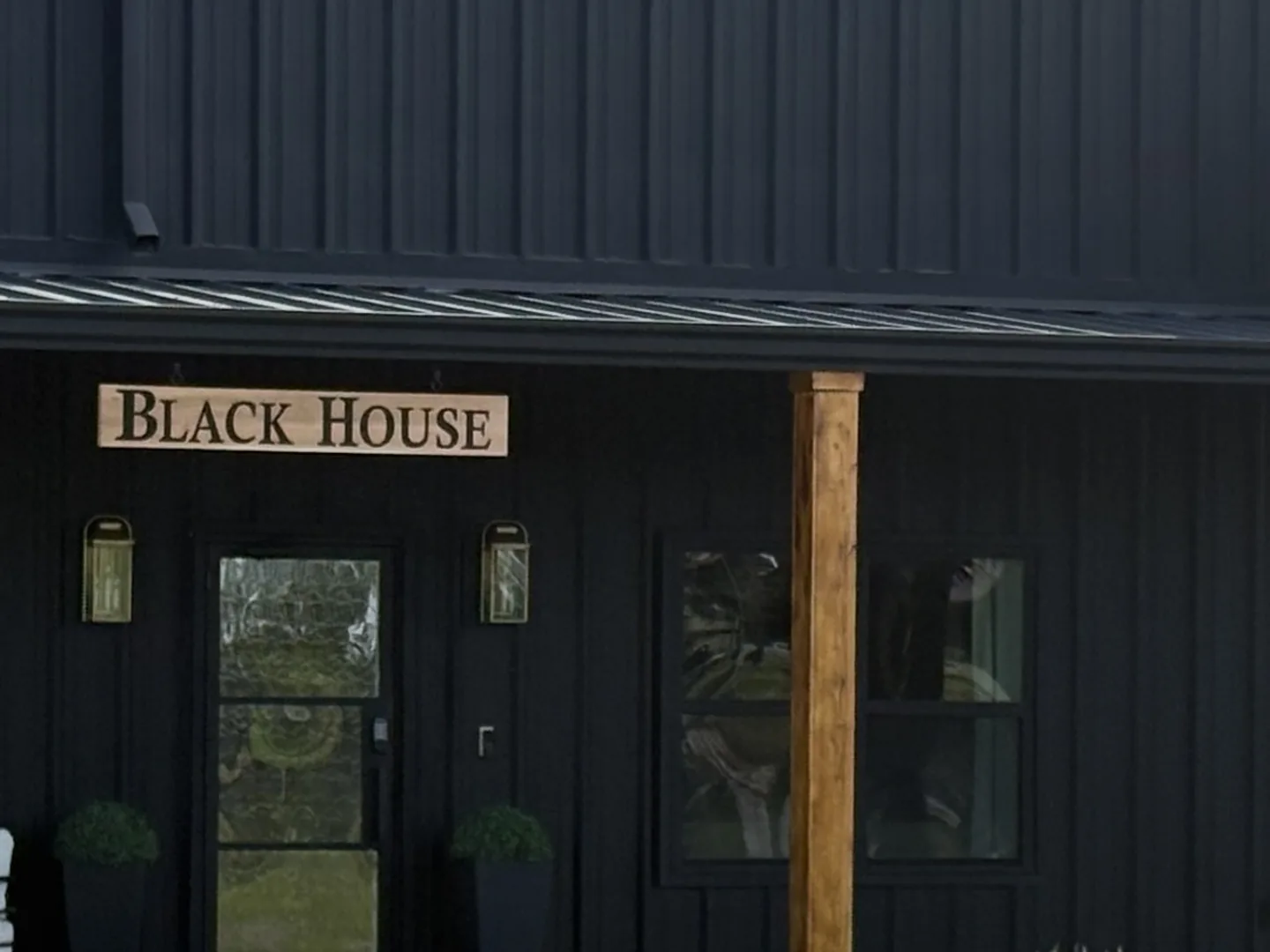 The courtyard entrance off County Road 125. If your appointment is in the Buying Room, park in the parking lot, follow the signs, and walk to the far left door, the main door of the Black House. If your appointment is in the Collector's Lounge, pull straight up in front of the showroom doors and stop on the concrete pad under the awning. We come out and greet you.